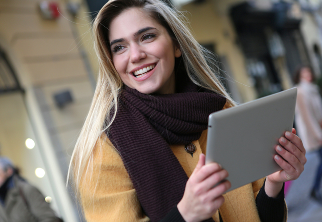 Woman holding retail pos tablet