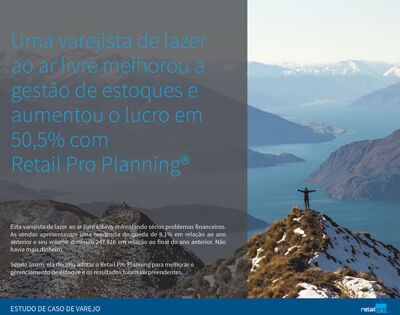 Man on mountain summit extending his arms into the air