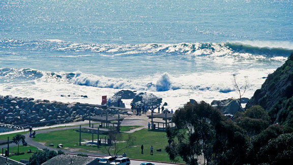 Beautiful beach with crashing waves under the sun