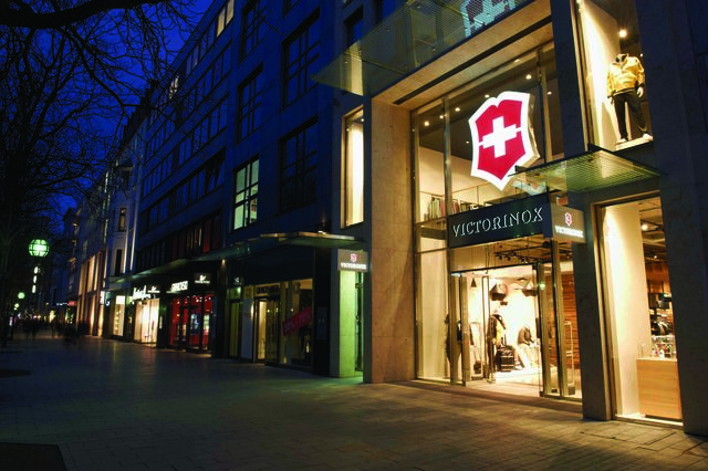 Entrance to Victorinox store viewed on at an angle on a posh street at night