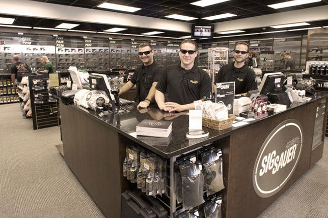 Owners and employees showcasing their pristine store.
