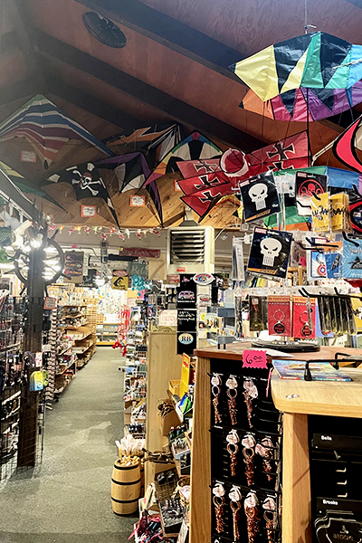 Kites and other goods for sale inside Flamingo Jim's