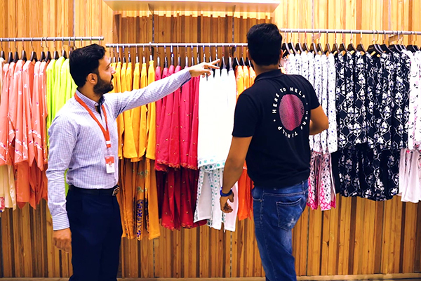 Sales Rep assisting customer in store