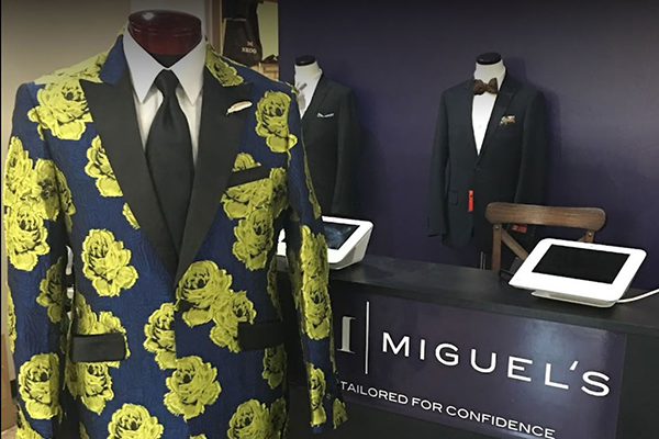 Suits on display at a Miguel's Formal Wear store