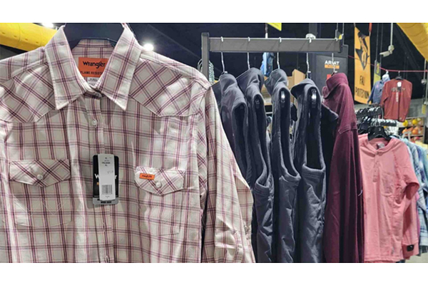 Shirts and Vests hanging on display inside of a Safety Wearhouse store