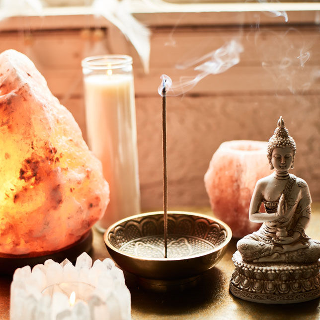 Incense burning on a boho table display.