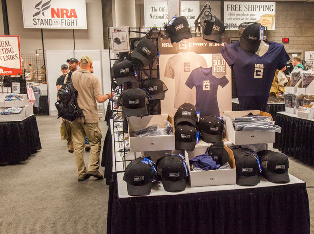People browsing inside the NRA store, thumbing through racks of clothes and et cetera.