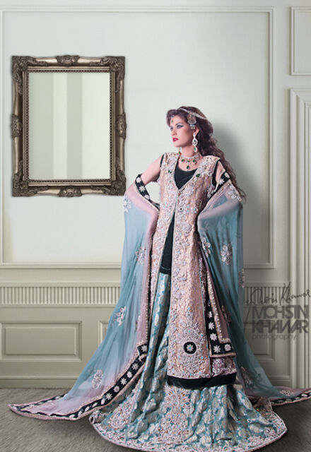 Woman wearing white and blue fabrics from Saleem Fabrics